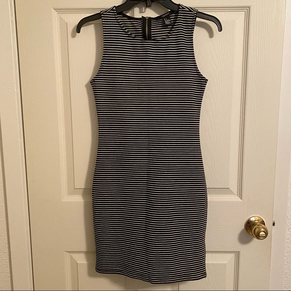 Forever 21 black and white striped sleeveless mini dress. Size S. Zips in back.